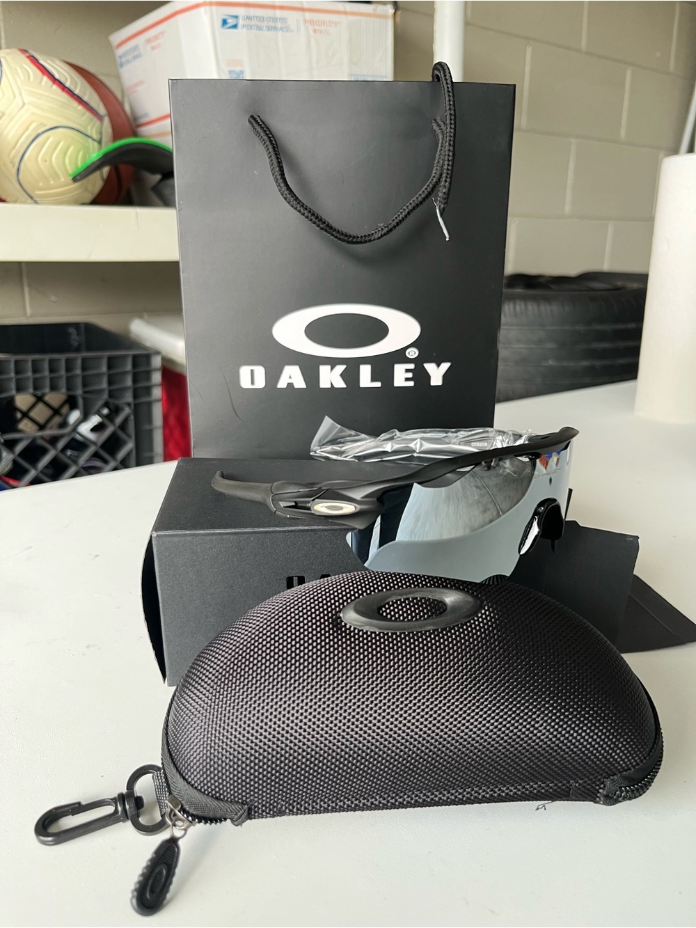 Oakley Black Frame Sunglasses with Silver Mirror Lens